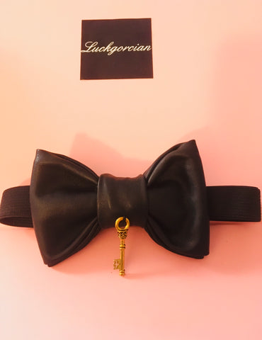 Leather bowtie with a key symbol