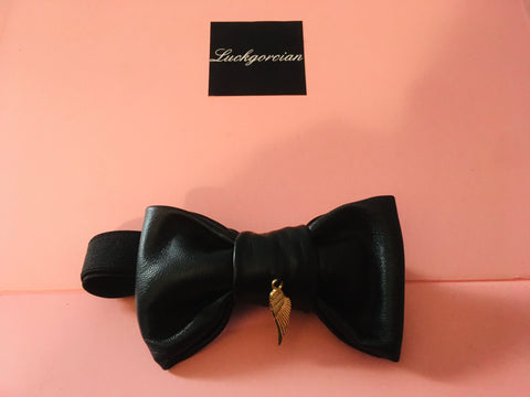 Leather bow tie with a angel wing symbol